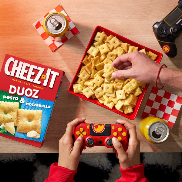 Cheez-It DUOZ Pesto and Mozzarella baked snack crackers in a 12.4 oz bag, featuring cheesy and savory flavors for lunch snacks