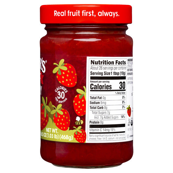 Jar of Crofter's Organic Strawberry Premium Fruit Spread with fresh strawberries on the label.