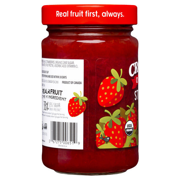 Organic strawberry fruit spread in a jar, featuring fresh strawberries and natural ingredients from Crofter's Organic brand.