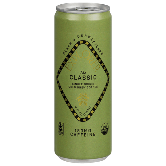 Black cold brew coffee in a clear glass bottle labeled Explorer Black Unsweetened by Duo Grocery, showing the dark liquid inside.