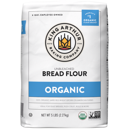 Bag of King Arthur Baking Company 100% organic unbleached bread flour, non-GMO verified, with a clear label and branding.