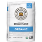 Bag of King Arthur Baking Company 100% organic unbleached bread flour, non-GMO verified, with a clear label and branding.