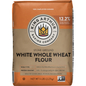 White whole wheat flour from King Arthur Baking Company, stone-ground, in a bag with the brand logo and product details visible.