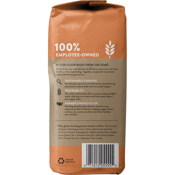 White whole wheat flour by King Arthur Baking Company, stone-ground, in a clear bag with the brand label visible.