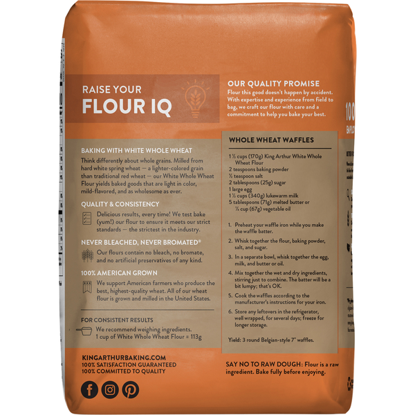 Stone-ground white whole wheat flour from King Arthur Baking Company, shown in a clear bag on a kitchen countertop.
