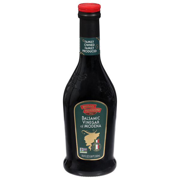 Bottle of Monari Federzoni Balsamic Vinegar of Modena from Duo Grocery, dark-colored glass with a label and silver cap.
