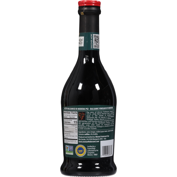 Bottle of Monari Federzoni Balsamic Vinegar of Modena with a dark, glossy appearance and traditional label on a white background.