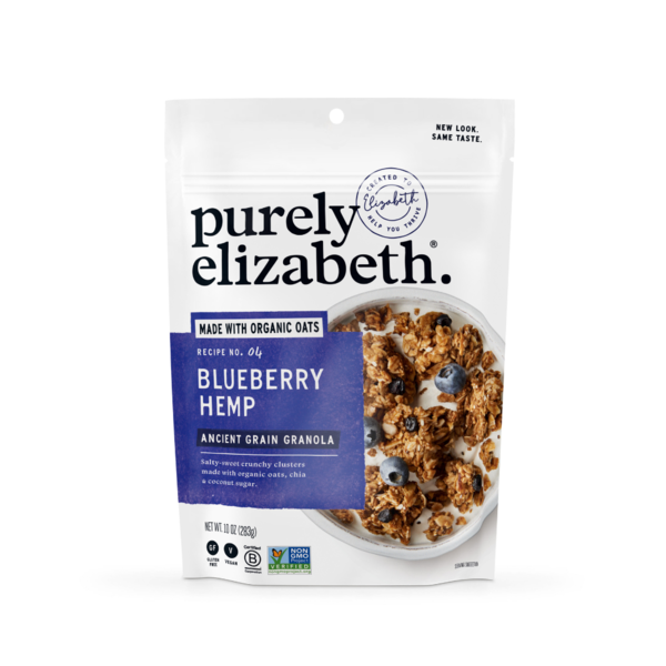Purely Elizabeth Blueberry Hemp Ancient Grain Granola in a clear bowl, showing blueberries, hemp seeds, and crunchy granola pieces.