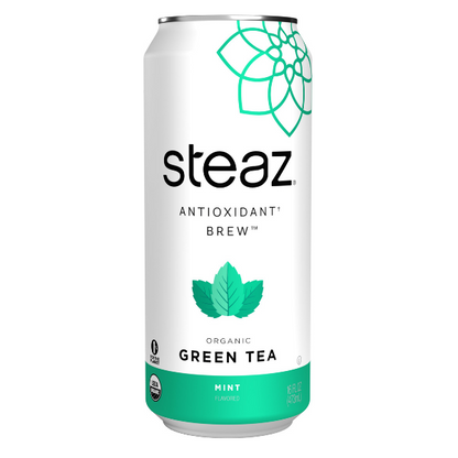 Cans of Steaz Antioxidant Brew Tea in mint flavor with fresh mint leaves on a white background