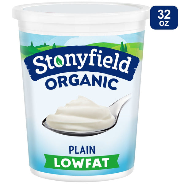 Plain Stonyfield Organic Lowfat Yogurt in a white cup, showcasing its smooth texture and creamy appearance.