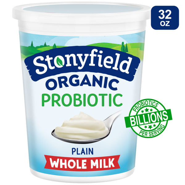 Stonyfield Organic plain whole milk probiotic yogurt container with a white label and blue cap, showcasing the product inside.
