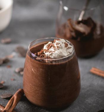 Creamy Dutch chocolate pudding by AmBari Nutrition in a bowl, showcasing rich, smooth chocolate dessert with a glossy finish.