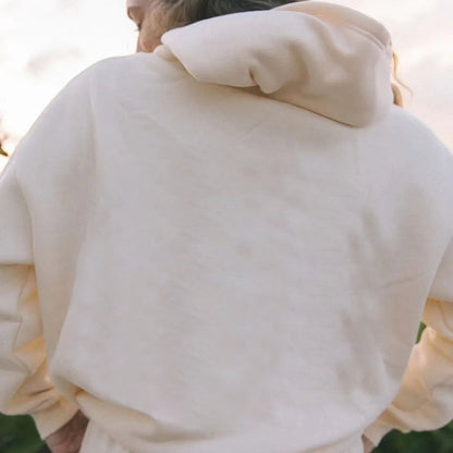 Women's solid-color loose-fit drop-shoulder hooded sweatshirt displayed front view