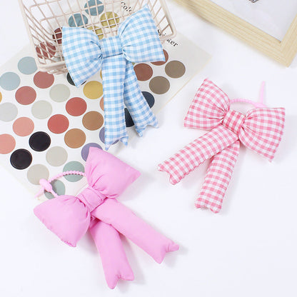 Fabric plaid bowknot bag pendant accessory close-up