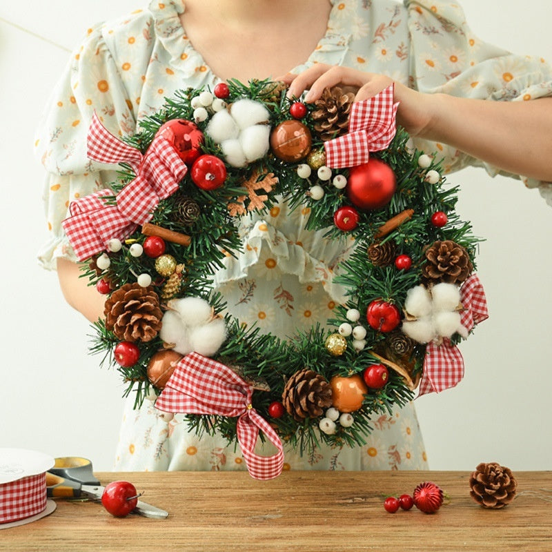 Christmas garland bow door hanging with festive ribbon and greenery for window decoration