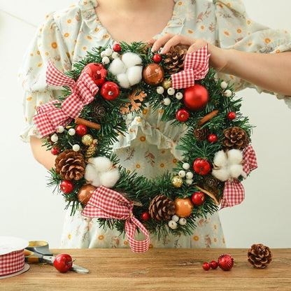 Christmas garland bow door hanging with festive ribbon and greenery for window decoration