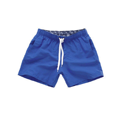 Men's beach pants summer surf shorts displayed on a plain background