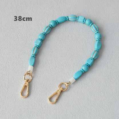 Vintage turquoise resin bag chain accessory close-up