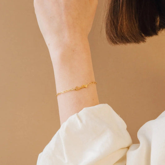 Custom name bracelet from Maiden-Art with delicate chain and engraved personalized name, stylish jewelry accessory.