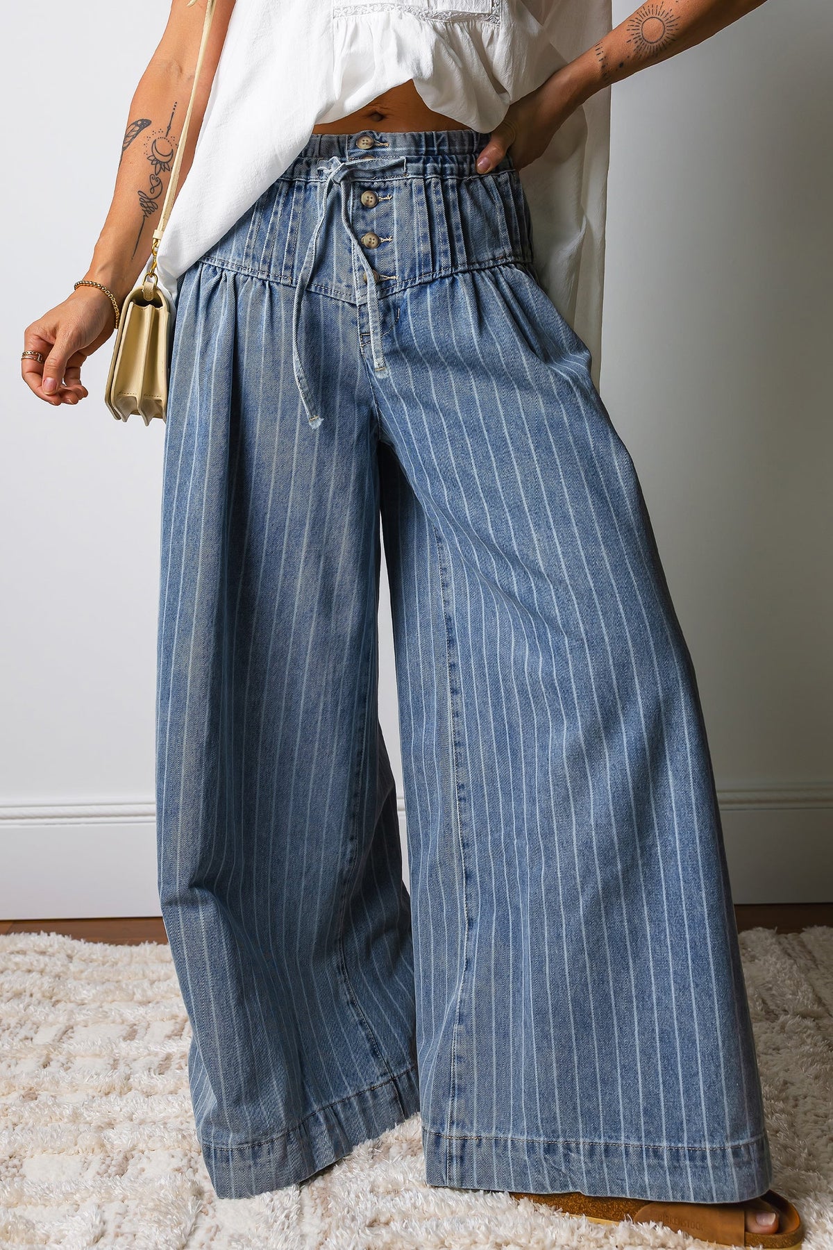 Light blue Sutton casual wide-leg jeans by Threaded Pear, showing the relaxed fit and wide leg design on a neutral background.
