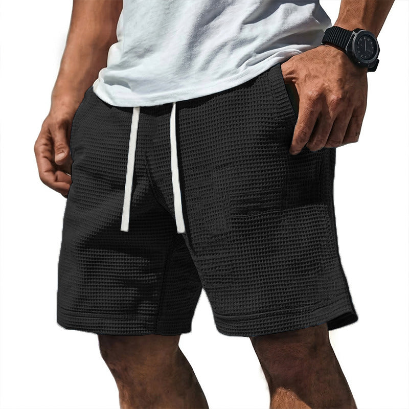 Men's casual waffle-weave shorts with drawstring waist and pockets in a textured fabric