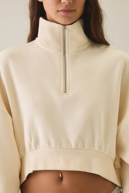 Women's half-zip lapel sweatshirt with loose fit, puff sleeves, and short pullover design