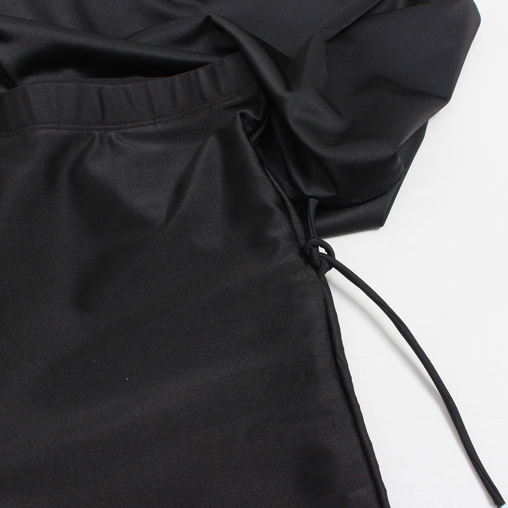 Women's three-piece conservative Muslim swimsuit with modest full-coverage design, black and blue fabric.