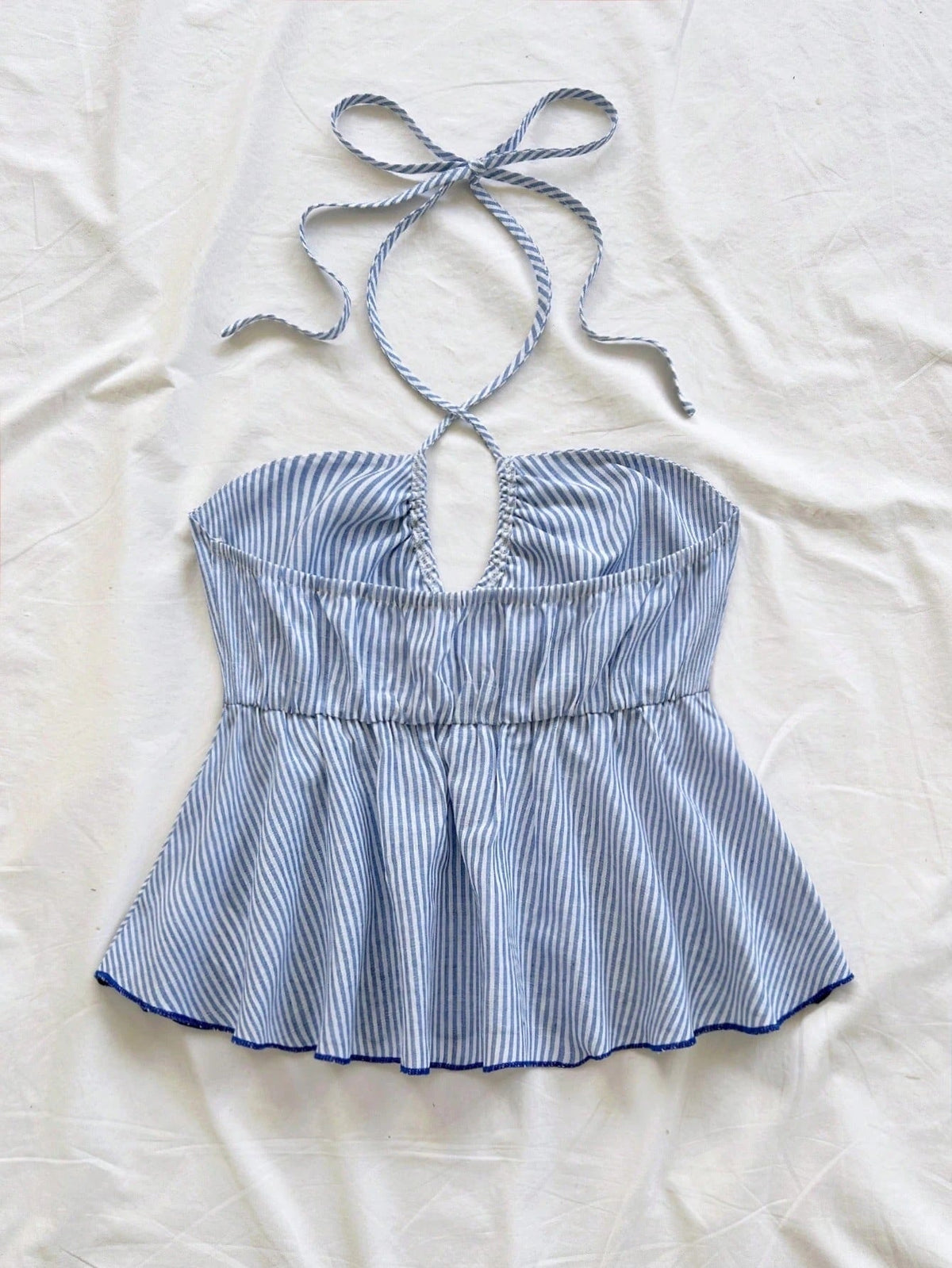 One-shoulder backless striped tie-top with an asymmetrical strap and adjustable back ties