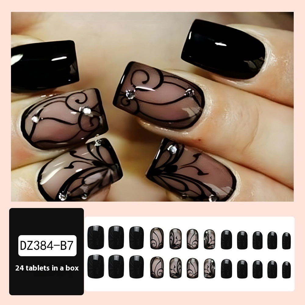 Black vine-inspired press-on nails with dark gothic design, close-up product image