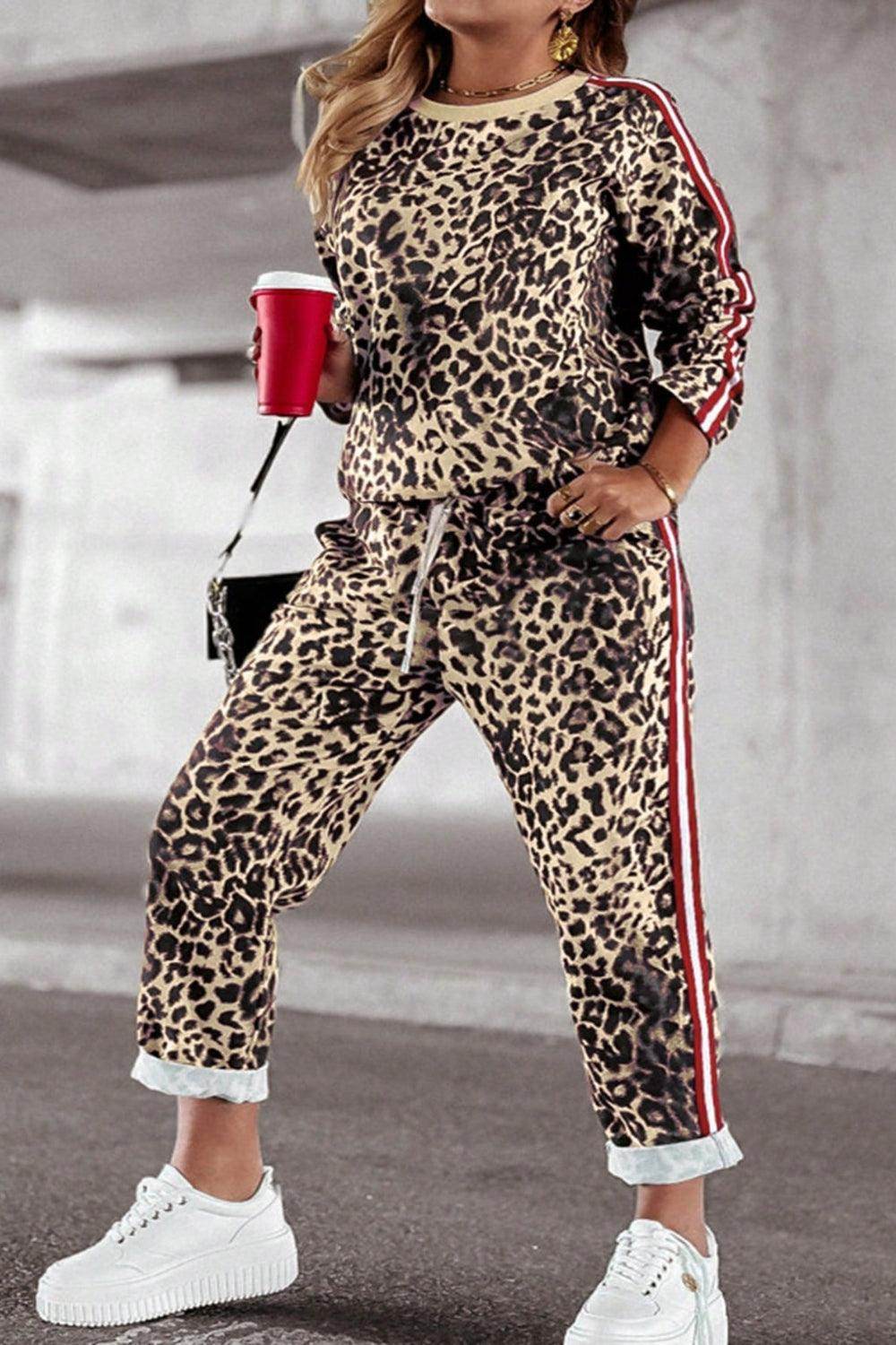 Plus size leopard print round neck top and matching pants set for women, stylish and comfortable fashion by Trendsi.