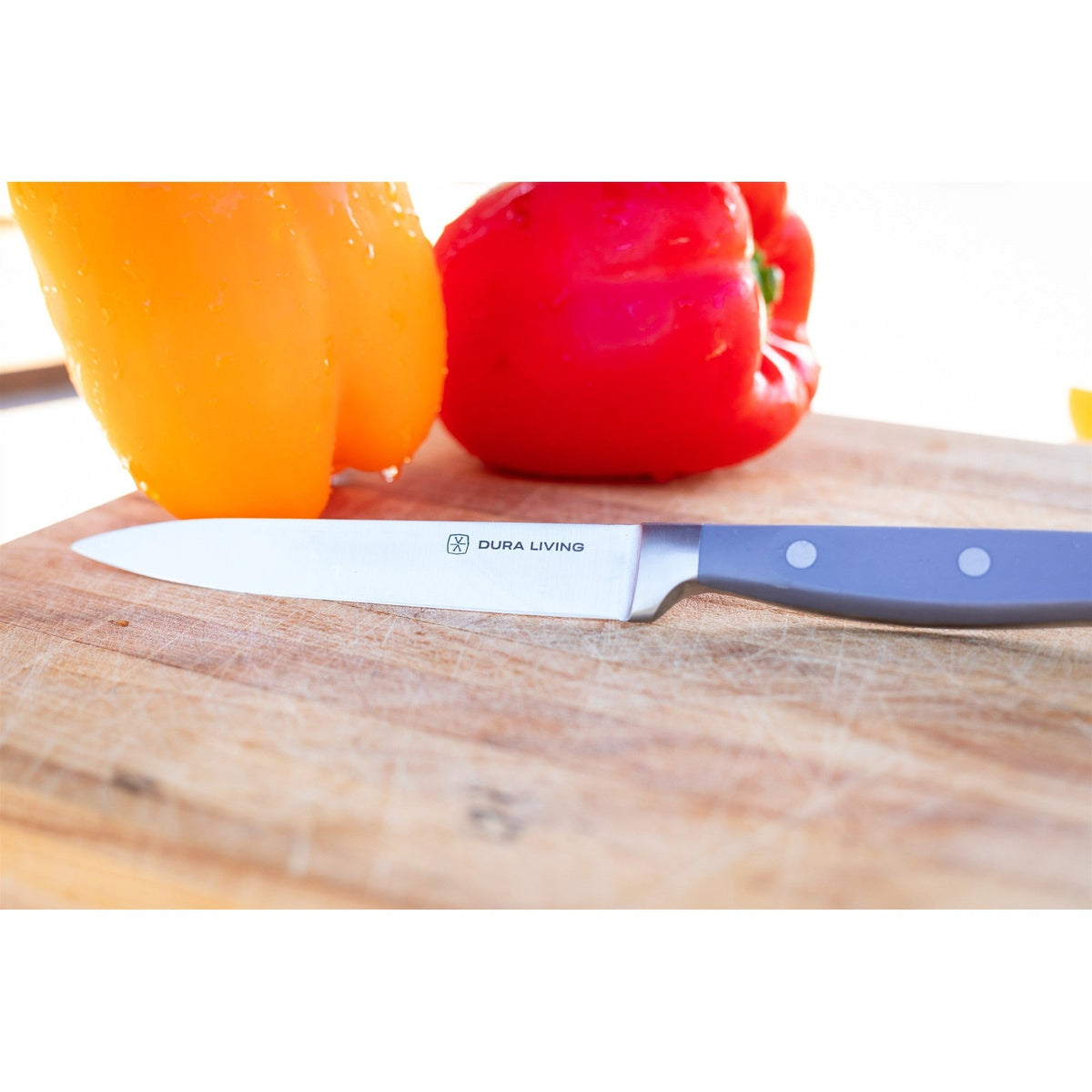 Dura Living Superior 2-Piece Kitchen Knife Set with gray handles and stainless steel blades, displayed on a wooden countertop