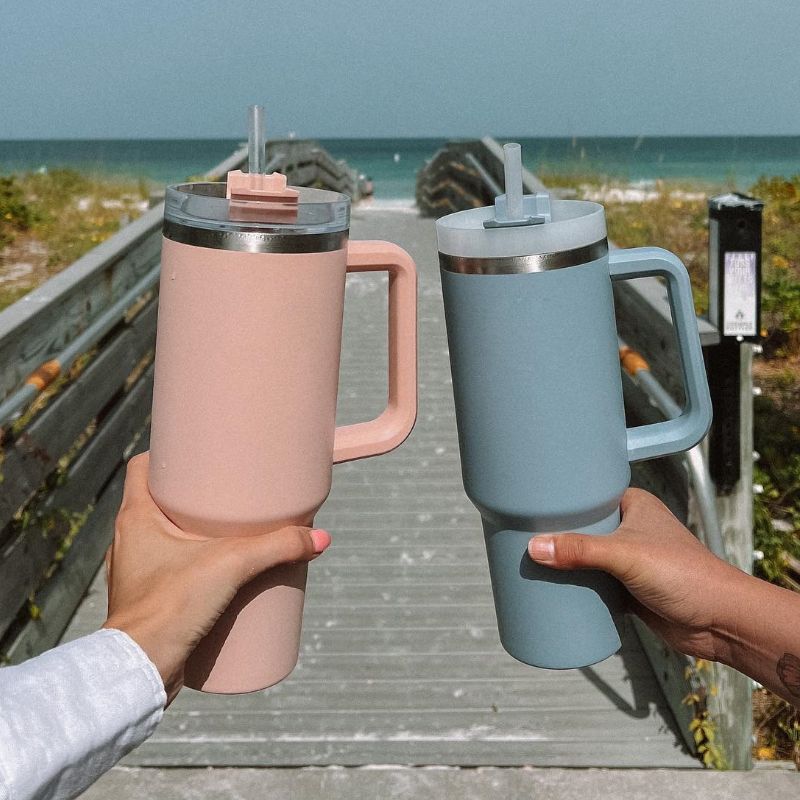 EasyOptionXY 1200ml stainless steel thermal travel mug with handle, straw, and drinkware design for hot and cold beverages.