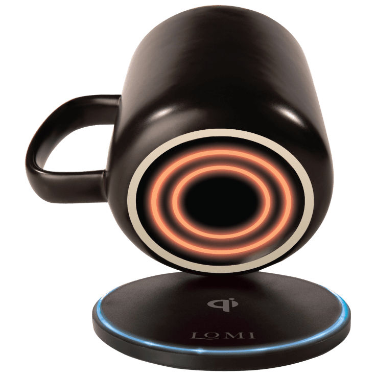EasyOptionXY 2-in-1 smart mug warmer and QI wireless charger on a desk, showcasing a sleek black device with glowing LED indicators.
