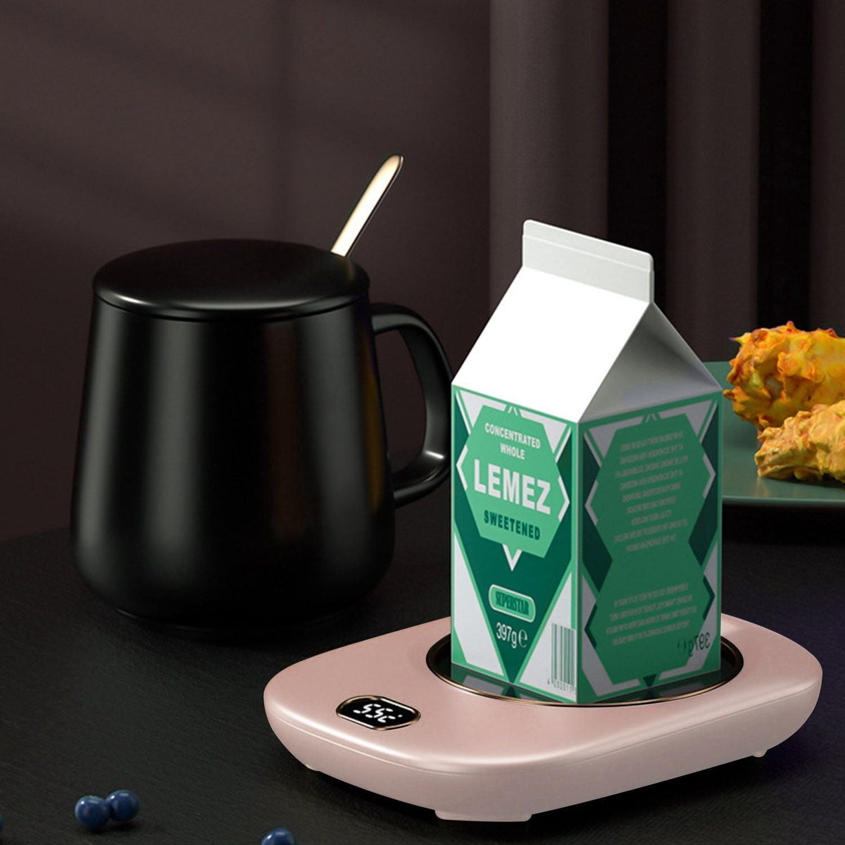 EasyOptionXY electric coffee mug warmer on desk with three temperature settings, USB powered, auto shut-off for tea or beverages.