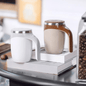 EasyOptionXY self-stirring Cup a Latte mug with a sleek design, featuring a button for easy mixing of beverages.