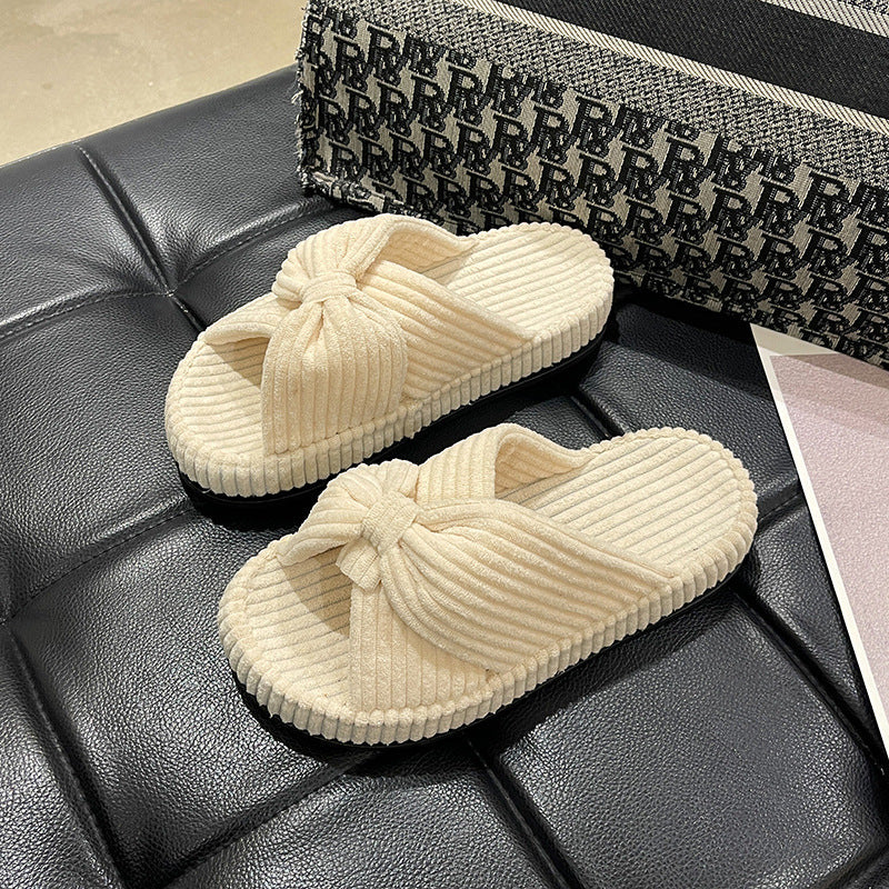 Women's cross-strap flat slide sandals in neutral tones, open-toe design with cushioned footbed