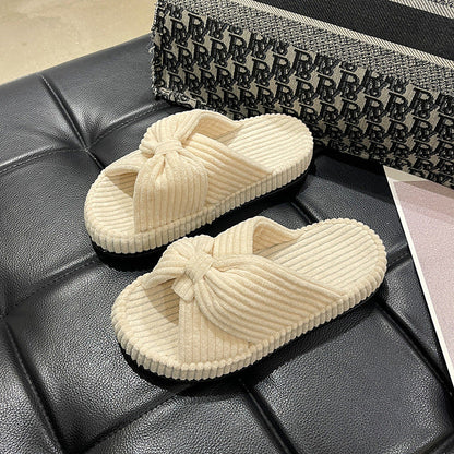Women's cross-strap flat slide sandals in neutral tones, open-toe design with cushioned footbed
