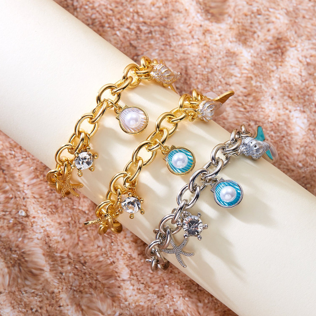 Women's starfish, pearl and shell multi-pendant fishtail necklace bracelet, close-up view
