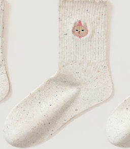 Embroidered ruffle-ankle socks for women in a soft, decorative design
