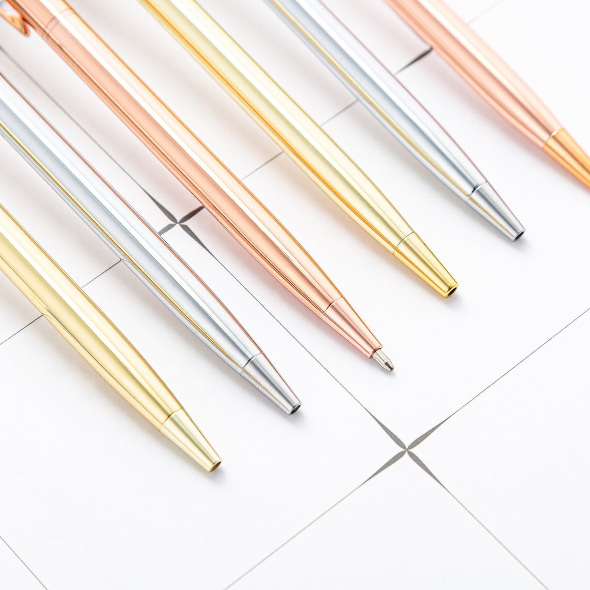 Little Gao Shi gold-plated ballpoint pen with polished metallic finish and clip