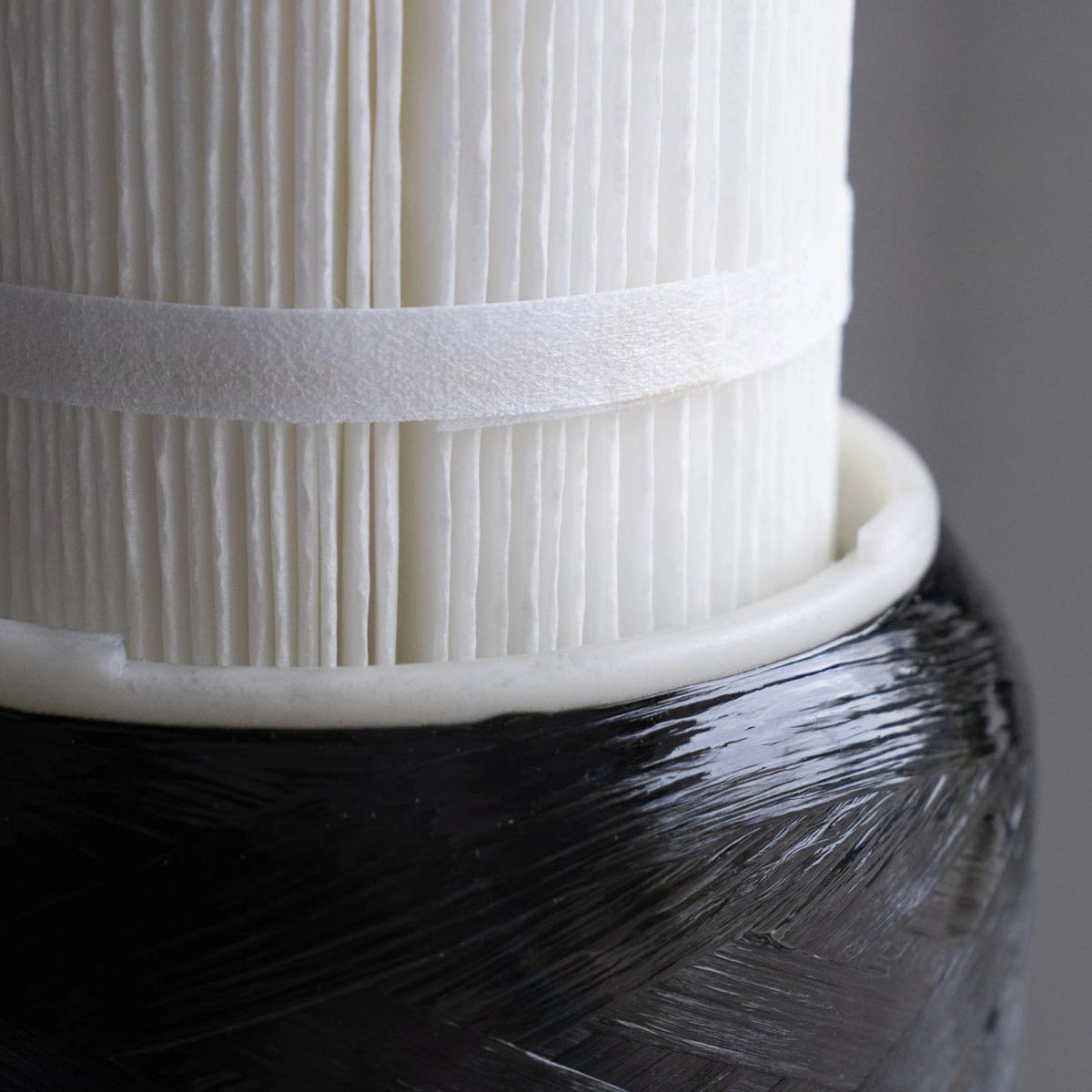 Close-up of the Echo Water Whole Home Water Filter unit showing its sleek design and filtration system components.