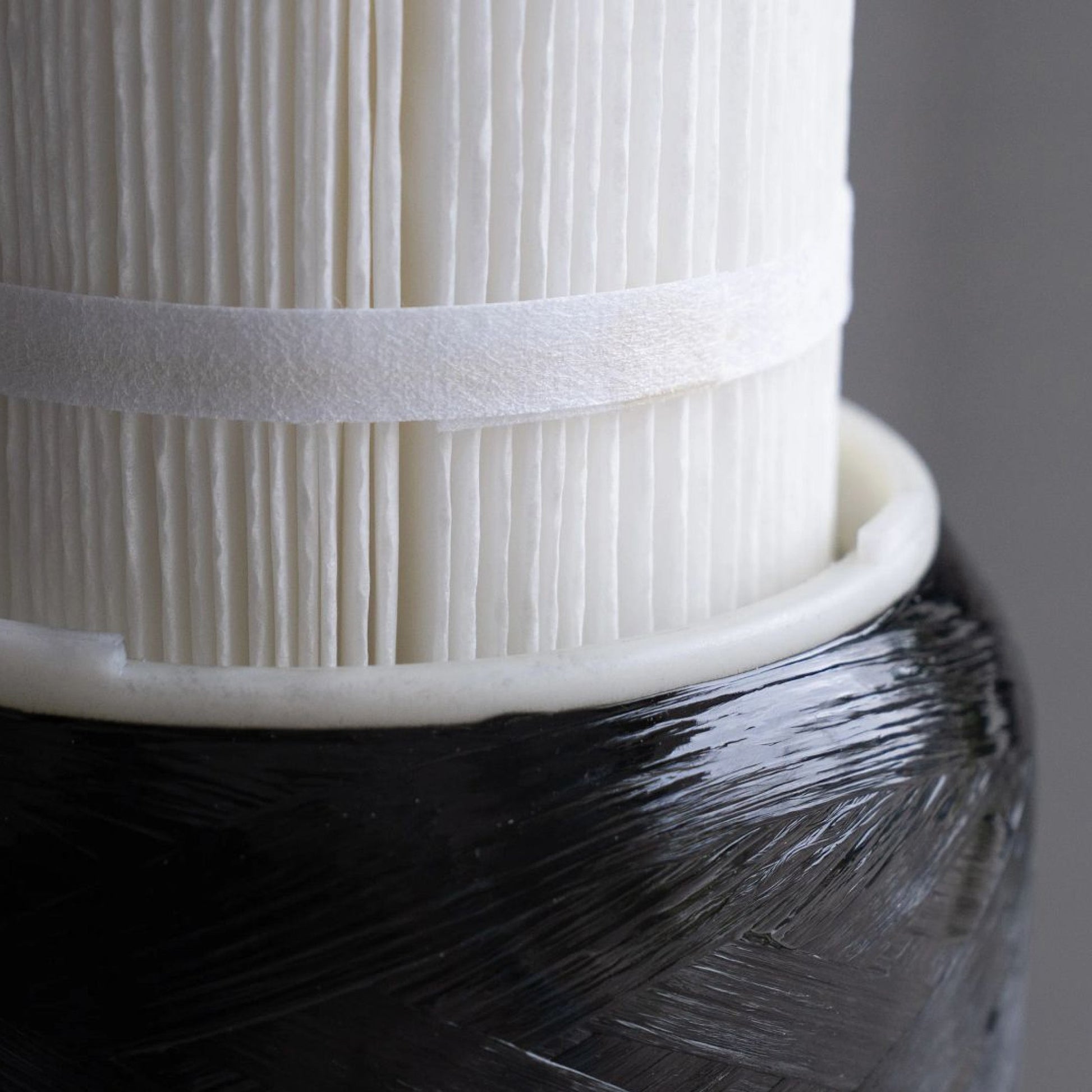 Close-up of the Echo Water Whole Home Water Filter unit showing its sleek design and filtration system components.