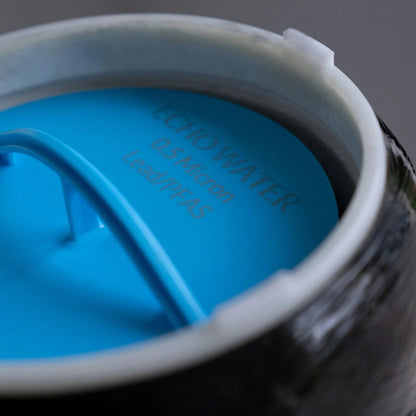 Close-up of Echo Water EchoPure3 whole home water filter showing its sleek design and filtration components.