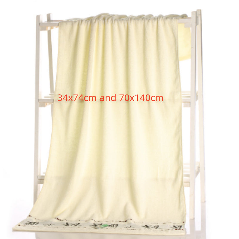 Bamboo charcoal fiber bath towel in a soft textured weave, displayed flat for a clear view of its surface and edges