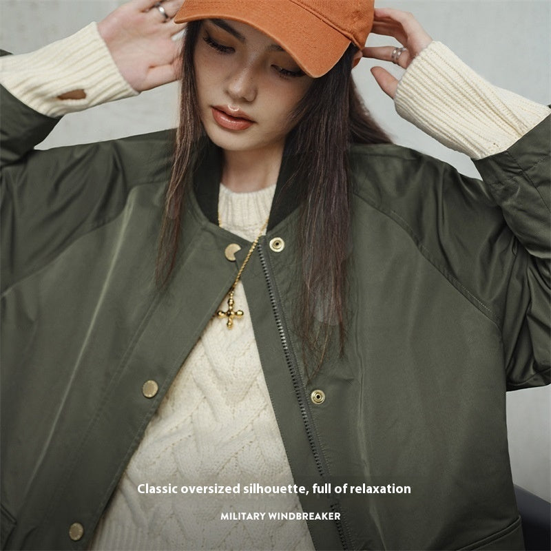 Retro olive green mid-length loose women’s trench coat viewed from the front