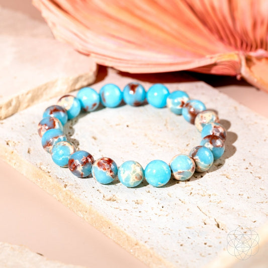 Aqua Terra Jasper bracelet from Conscious Items called Empath’s Shield, featuring polished stone beads on an elastic band.