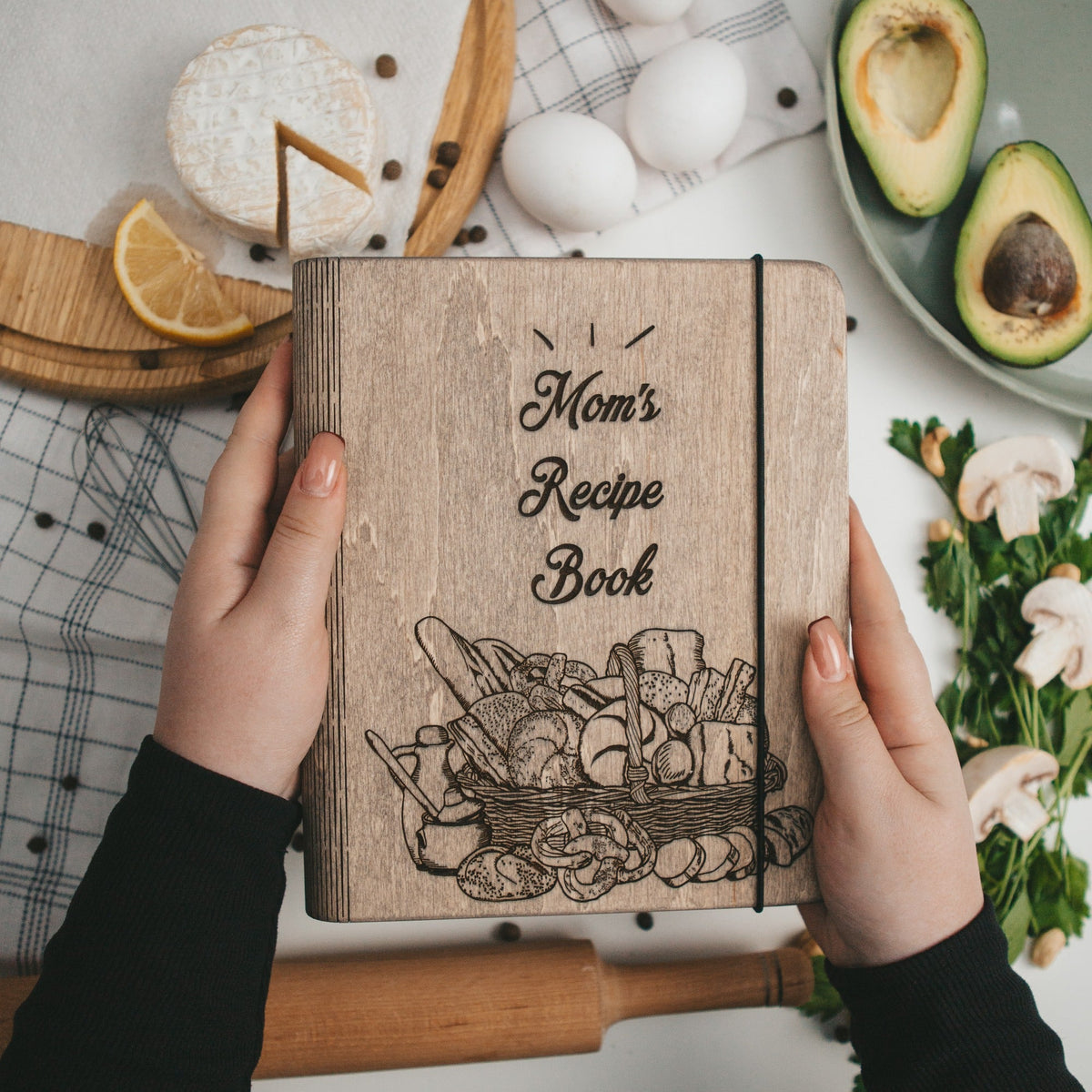 Enjoy The Wood recipe book basket with a cozy, organized container holding a recipe book and cooking accessories.
