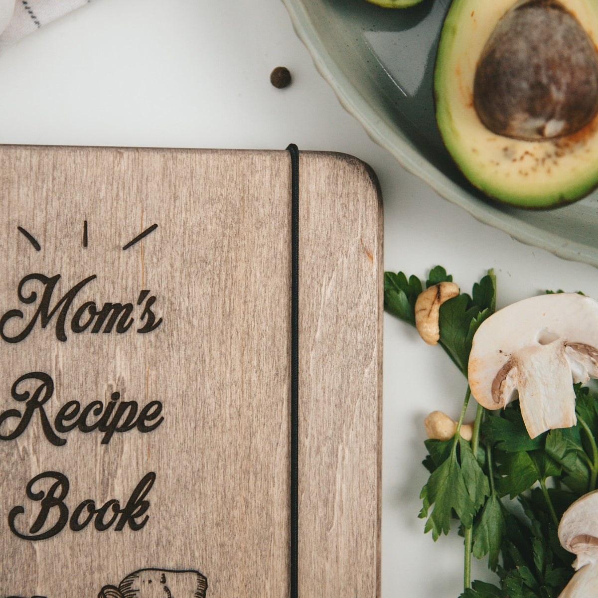 Enjoy The Wood recipe book basket featuring a cozy, organized container with a classic recipe book inside for kitchen use.