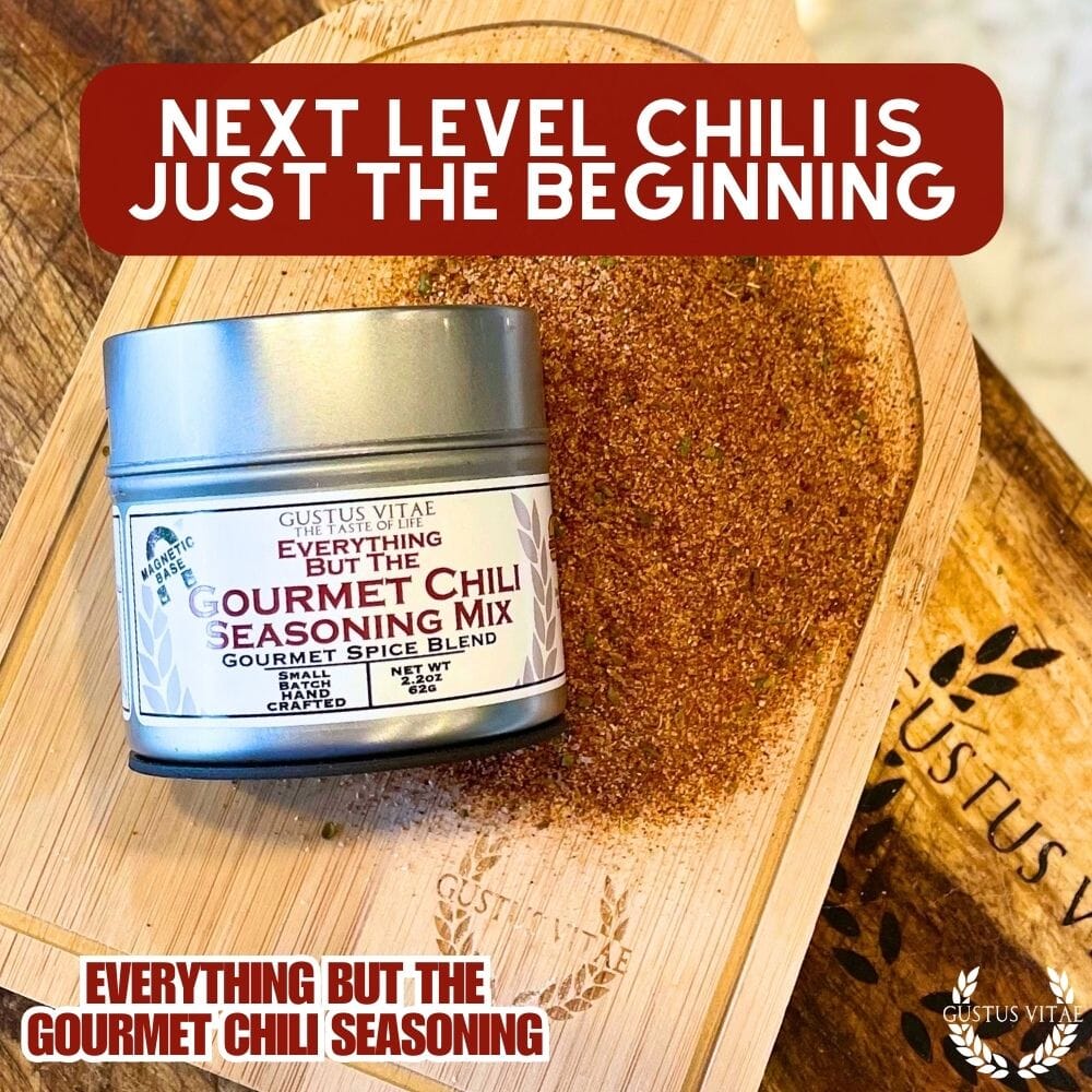Gustus Vitae Everything But The Gourmet Chili Seasoning jar showing a colorful blend of spices in a glass container.