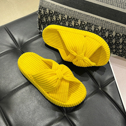 Women's cross-strap flat slide sandals in a minimalist design